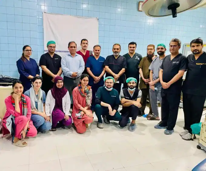 Prof. Dr. Muhammad Irshad Malik with his team after successful cochlear implant surgery at Jinnah Hospital