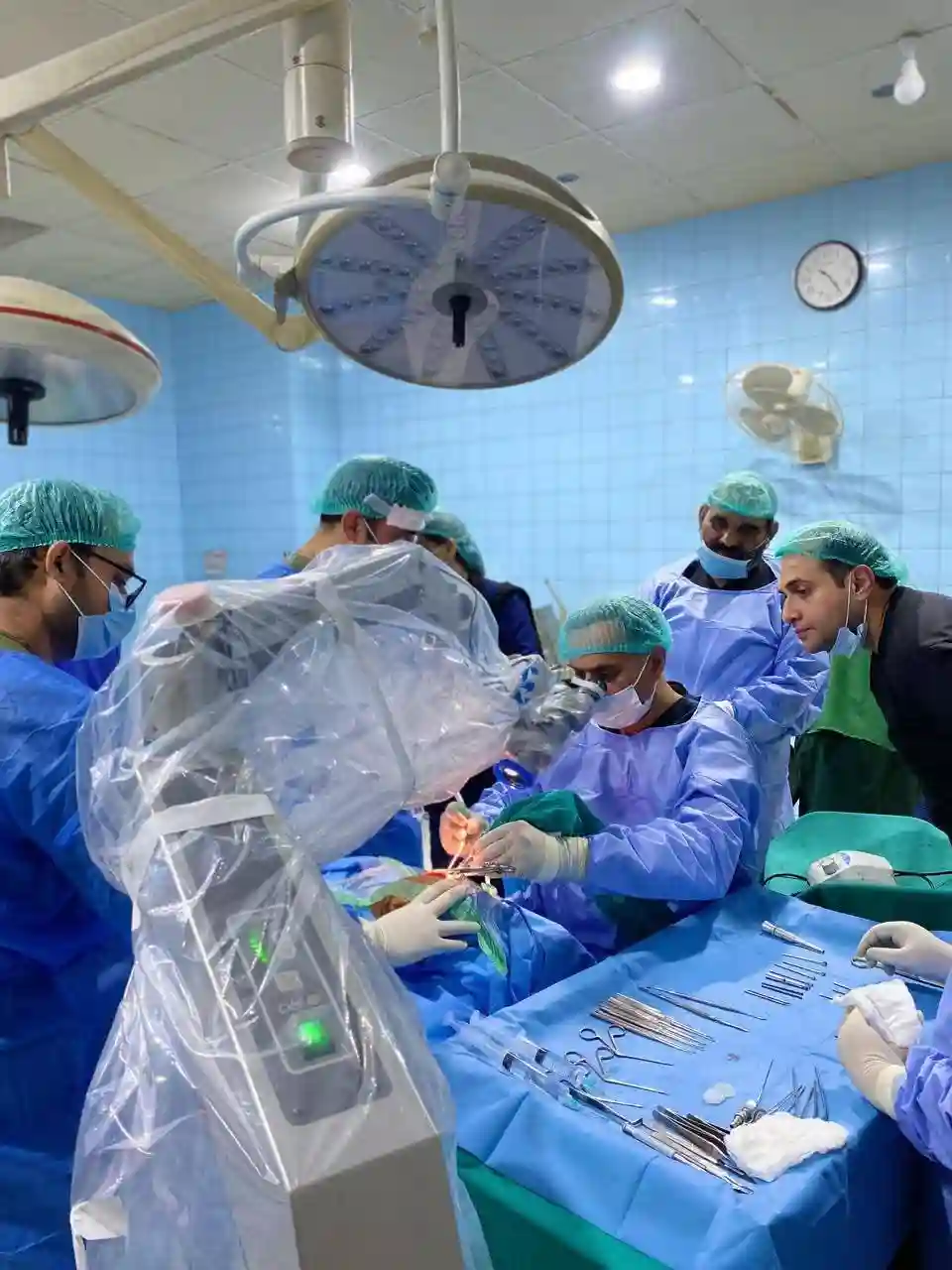 Prof. Dr. Muhammad Irshad Malik with other ENT doctors performing surgery